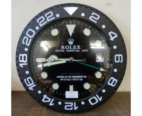 A Rolex style dealer's display wall clock 