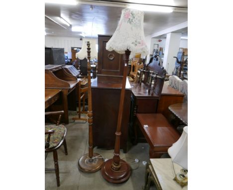 An oak standard lamp and a mahogany standard lamp 