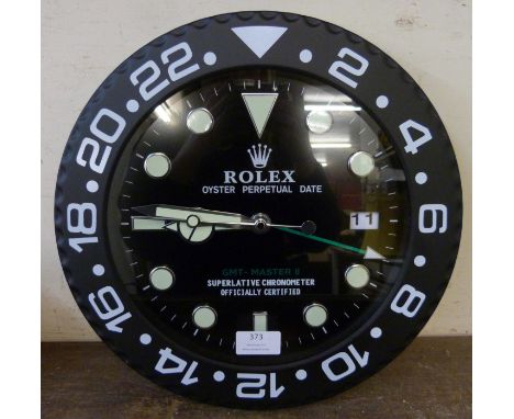 A Rolex style dealer's display wall clock 