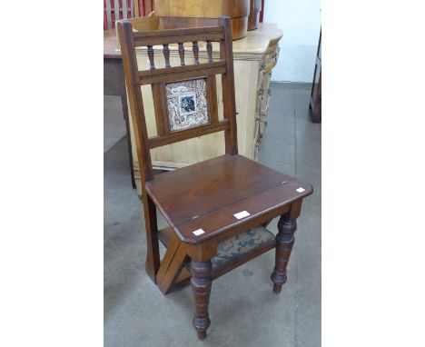 A Victorian Aesthetic Movement mahogany metamorphic library chair/step, inset with Mintons style tile 