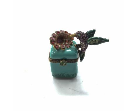 Delicate trinket box with enamel and colorful crystals. Jay Strongwater stamp on the bottom. Dimensions: 1.5"L x 1"W x 1.25"H