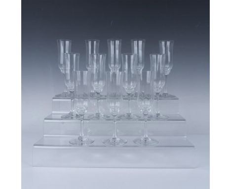 Stunning crystal champagne flutes in the Capri pattern with intricate and slender design. Baccarat etched marking. Dimensions