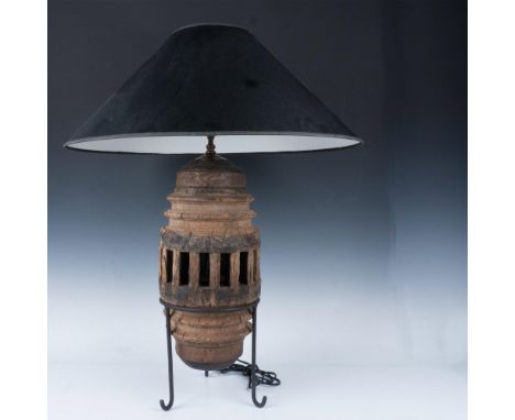 Wood carved base set-in tripod metal stand makes a dramatic interior design feature when coupled with wide black lampshade (1