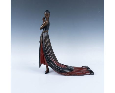 A striking bronze sculpture depicts a beautiful woman in a flowing red and black dress, her hands gently clasped together as 