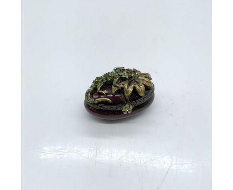 Beautiful trinket box decorated with enamel and colored crystals. Jay Strongwater stamp on the bottom. Dimensions: 1.5"L x 1"
