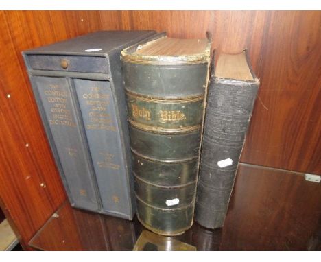A large family devotional bible by the Rev. Matthew Henry, with clasp, together with a similar sized bible and the compact ed