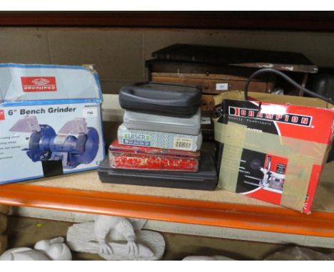 A selection of tools to include a boxed bench grinder, a plunge router plus other hand tools