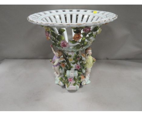 A modern reproduction cherubic table ceramic centerpiece 