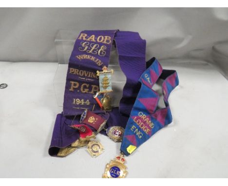 A Buffalo sash dated 1944 complete with two hallmarked silver gilt and enamel medals plus a few silver plated examples 