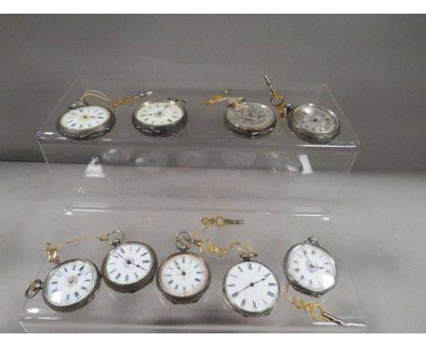 Nine Victorian silver cased pocket watches and keys 