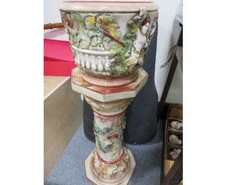 A ceramic jardinière decorated with classical figures 