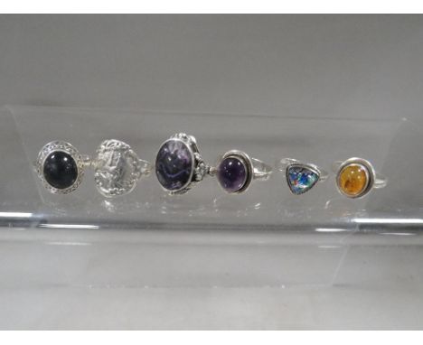 Six vintage ladies silver dress rings, including amber and blue john set examples