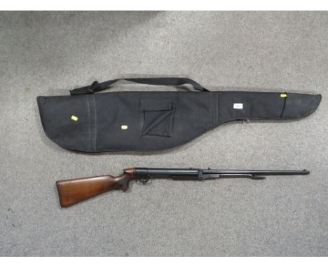A vintage Lincoln under lever air rifle with wooden stock, serial number 13873 with a modern soft carry bag