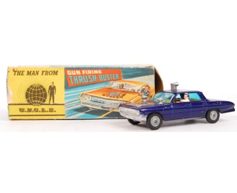 An original vintage Corgi diecast model No. 497 ' Gun Firing Thrush Buster ' from The Man From UNCLE television series. Model