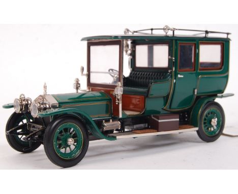 A Franklin Mint 1:24 scale precision diecast model 1907 Rolls Royce Silver Ghost. Appears mint, likely never removed from box