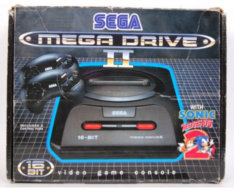 An original vintage SEGA Mega Drive II games console. ' 16 Bit ' Appears to be complete, including the ' Sonic The Hedgehog '