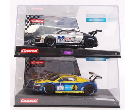 Two 1/32 scale Carrera Evolution plastic racing slot cars to include; 27321 Audi R8 LMS &amp; 27322 Audi R8 LMS Team Phoenix.