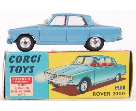 An original vintage Corgi Toys diecast model No. 252 ' Rover 2000 ' with Trans-O-Lite headlamps. Blue, with red interior. App