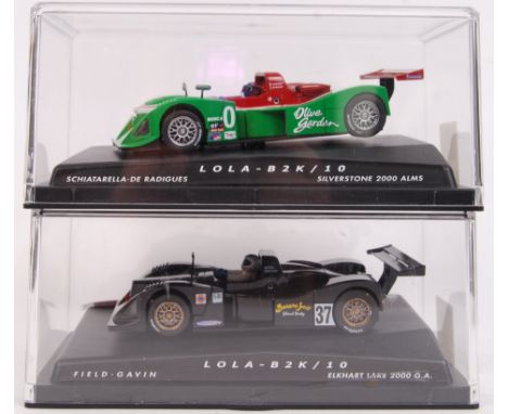 A pair of 2x 1/32 scale Spirit plastic racing slot cars to include; 0100104 Lola B2K/ 10 Green &amp; 0100101 Lola B2K/ 10 Neg