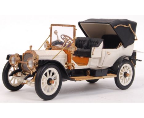 A Franklin Mint 1:24 scale precision diecast model 1912 Packard Victoria. Appears mint and complete within its original polys