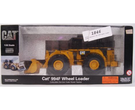 An original Norscot 1;50 scale 55161 diecast model CAT 994F Wheel Loader. Mint. Within the original box.   Note: from an exte