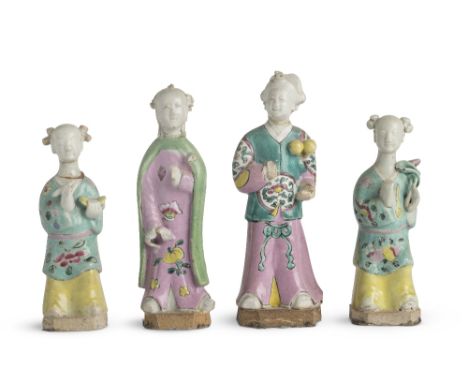 Four Chinese famille rose figures Qianlong Including a pair of standing female figures wearing yellow and green ground robes 