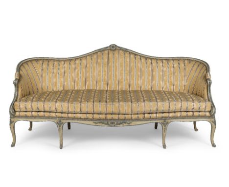 An 18th century painted sofa English in the Louis XV style The moulded shaped back centred by a patera and trailing bell flow