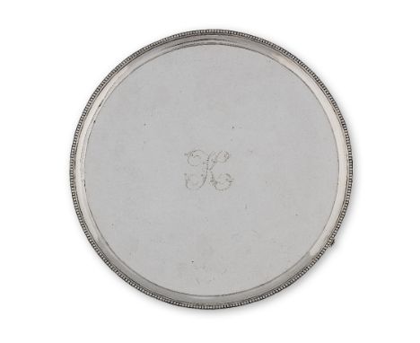 A George III silver salverThomas Chawner, London 1786 Of circular form with a beaded border leading to a central engraved 'K'