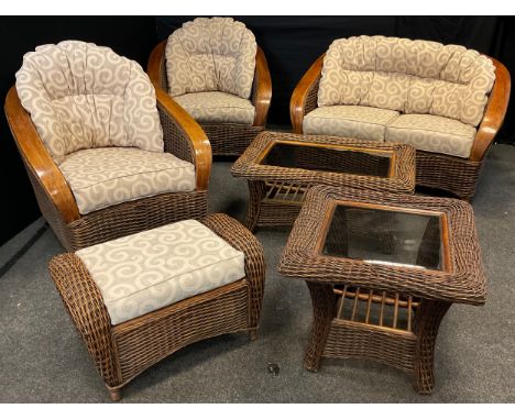 A cane wicker-work conservatory suite - comprised of a two-seat sofa, pair of armchairs, footstool, coffee table, and side ta