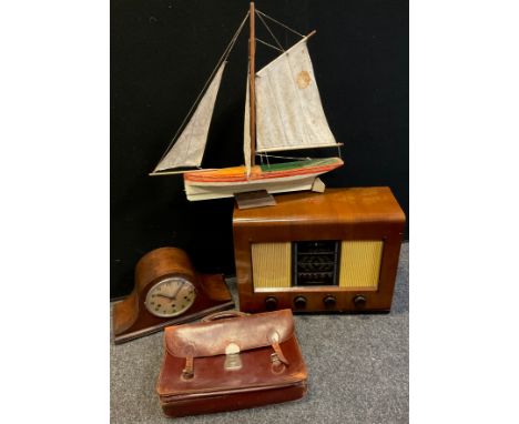 A model pond yacht, single mast and sail, wooden hull painted red and white, 55cm high, 62cm long;  Bush type ACII valve radi