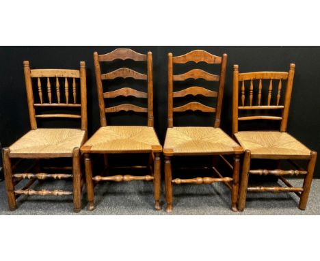 A pair of 19th century Elm rush-seated chairs, ladder-backs, turned stretchers and supports, 101cm high x 50cm wide;  another
