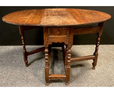 A George III oak gate-leg table, oval top, single drawer to frieze, turned supports, 71.5cm high x 93cm x 33cm (117.5cm with 