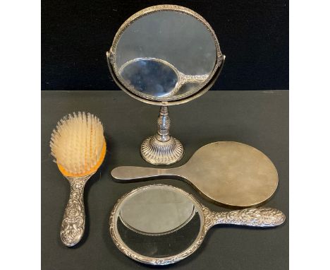 A silver hand mirror, engine turned back, London 1955;  another mirror and brush, Birmingham 1971, silver plated gimbaled mir