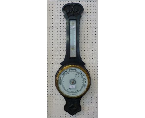 An oak framed aneroid barometer 
