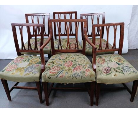 A set of six George III mahogany rail back dining chairs, with tapestry padded seats (1+5)