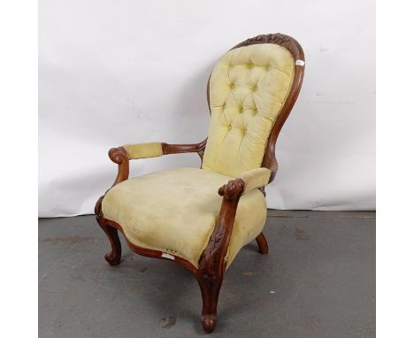 A 19th century walnut framed button back armchairSplits to the frame, loose on the joints, needs re-upholstering, general wea