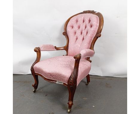 A 19th century walnut framed button back armchairStructurally sound, general wear, staining to the upholstery