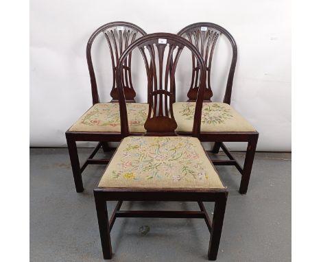 A set of three mahogany hoop back dining chairs, with tapestry drop in seatsStructurally sound, general wear, seats worn