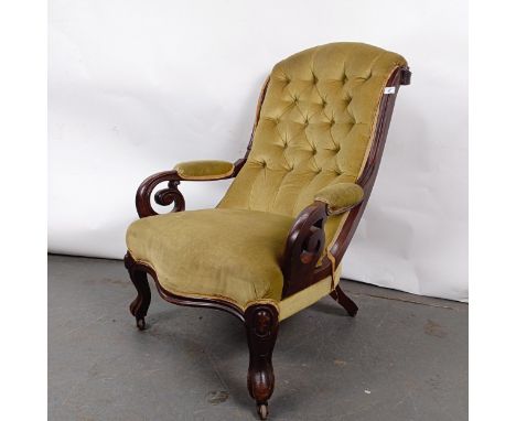 A Victorian mahogany framed button back armchairStructurally sound, variation of colour, wear to the upholstery