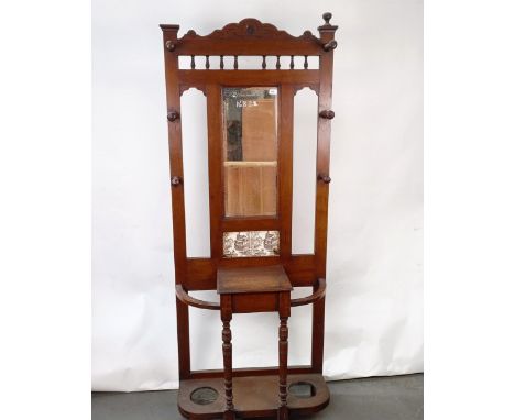 An Edwardian mahogany hall stand, inset with two tiles, 81 cm wideHeight 196 cm, one of the tiles has a crack, variation of c