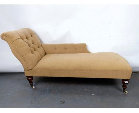 A 19th century button back chaise longue, with mahogany legs to castors, 180 cm wide
