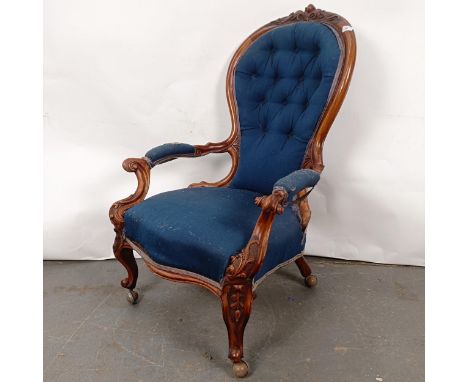 A Victorian walnut framed button back armchairIn need of restoration