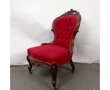 A Victorian mahogany button back nursing chairSplits to the frame, various losses, upholstery worn