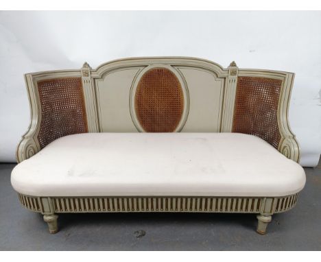 A Continental two seater sofa, with a painted and canework frame, 146 cm wideVarious losses, not fully upholstered, fabric st