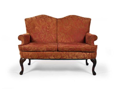 An 18th century style camelback sofa, two-seater with scroll back and arms, raised on carved mahogany cabriole supports.129cm