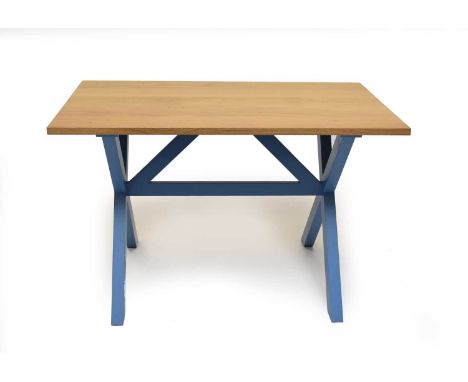 A modern light oak and painted wood kitchen table by Nick Over, the plain undecorated top raised on an X-frame trestle type b