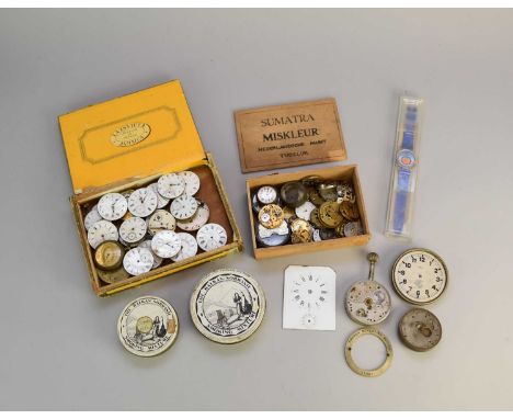 A miscellaneous collection of pre-war, Swiss watch movements, wristwatch and pocket watch movements and dials and spare parts