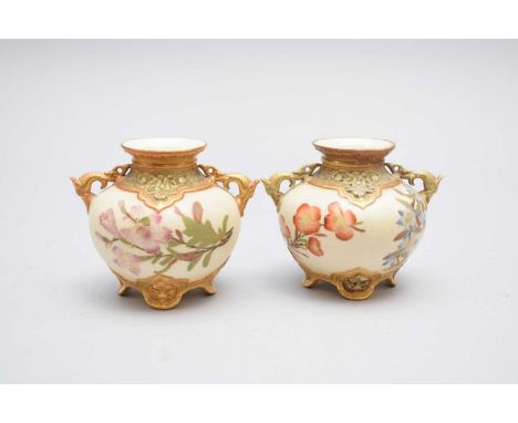 A pair of Royal Worcester 'old ivory' vases, circa 1885, of globular form with everted rims and twin moulded handles, painted