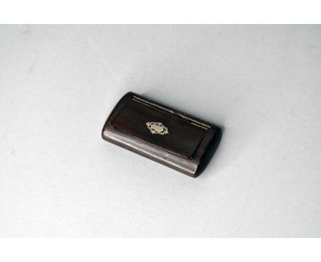 A 19th century treen rosewood snuff box, of cushion form, the hinged top inlaid with a white metal vacant cartouche, 8cm wide