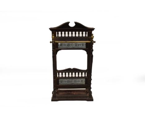 A late Victorian cast iron and brass stick stand, of architectural form and inset with printed tiles above a lift-out drip tr